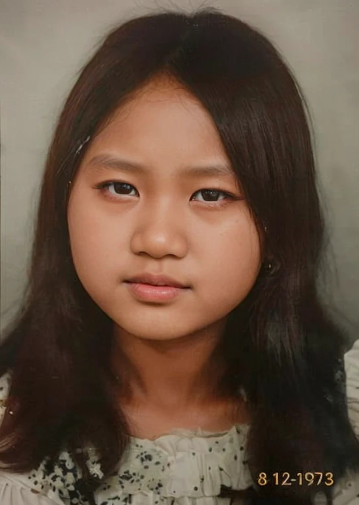 color photo, close up. A young Indonesian girl aged 12 years, black hair, wearing a white dress. dark black background studio photo, 8k, ultra HD