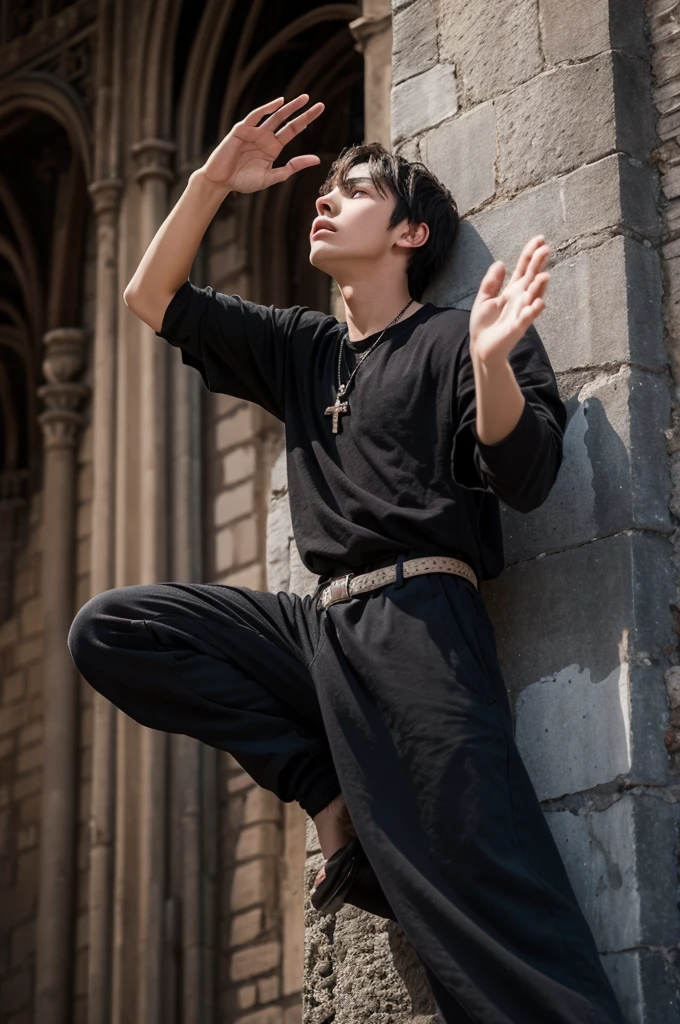 A 19-year-old boy with dark hair and clear eyes waving his hands toward the sky from a medieval tower.