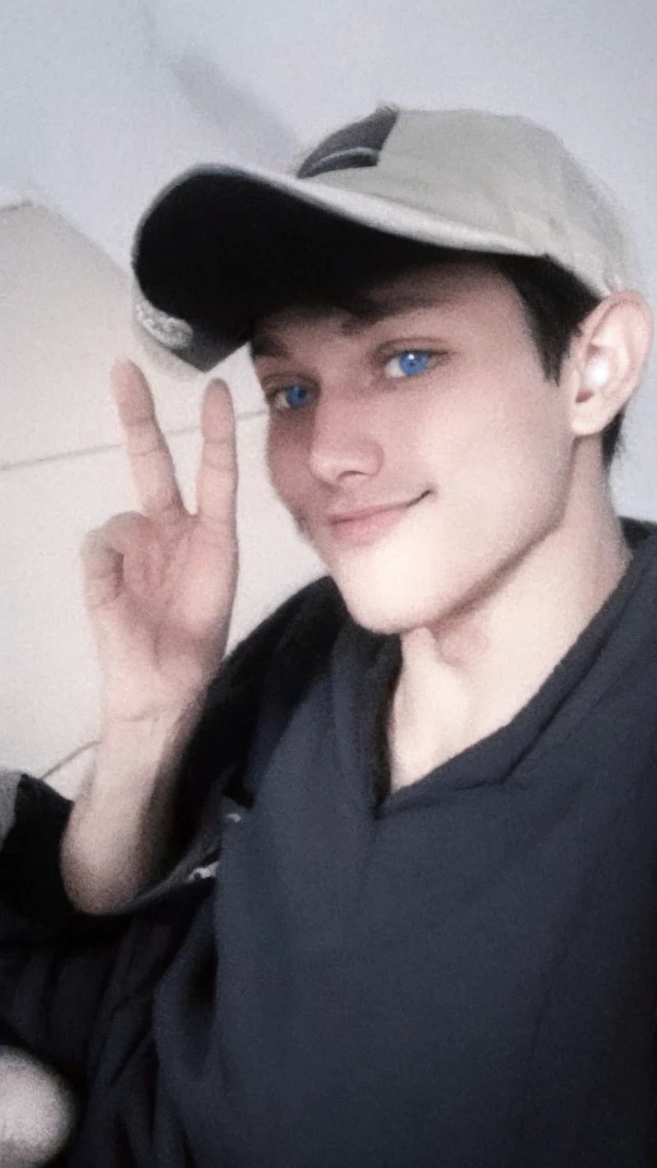 young man, black hoodie, masker, blue eyes, night