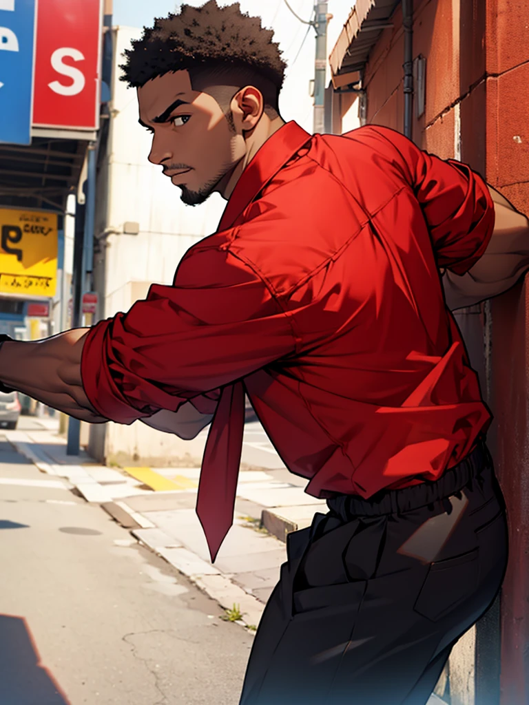 A black guy with a red armless shirt