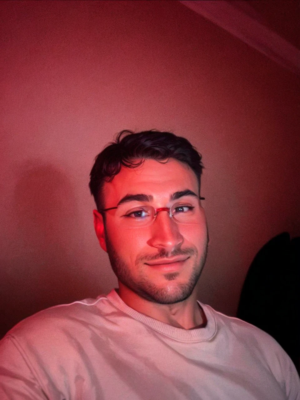 Let's have an animation-style actor with normal glasses on his eyes, headphones on his ears, as if he's playing a game, or a gun in his hand.