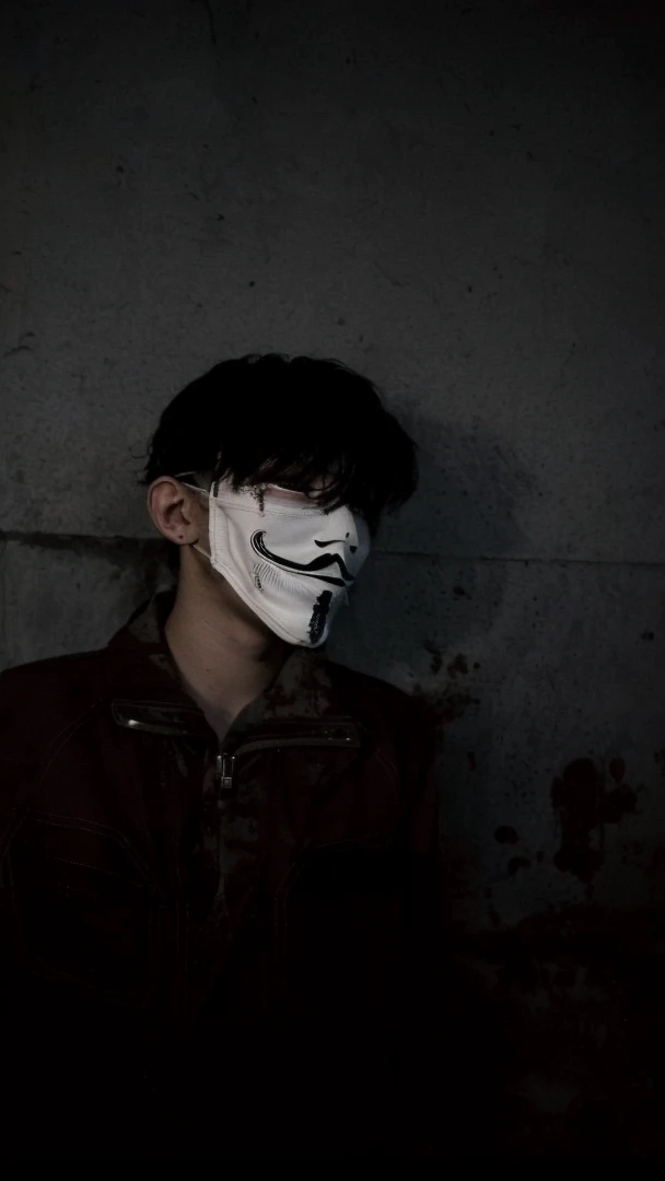 arafed man wearing a mask with a creepy face, twisted god with no face, darkwave goth aesthetic, anonymous mask, anonymous, masked person in corner, in an alleyway during the purge, creepy aesthetic, broken mask, pale white face, dark academia aesthetic, photo of scp-173, bladee from drain gang, scary look, horror aesthetic
