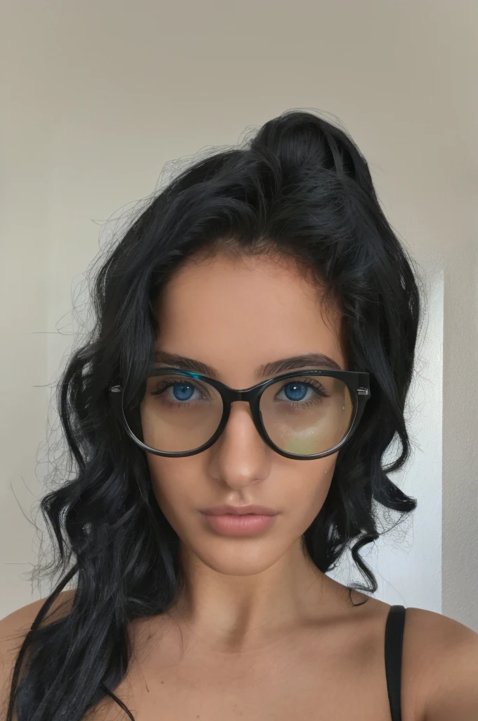 very attractive and alluring young italian girl with green blue eyes. black curly hair and sexy glasses. 20 years old taking a selfie