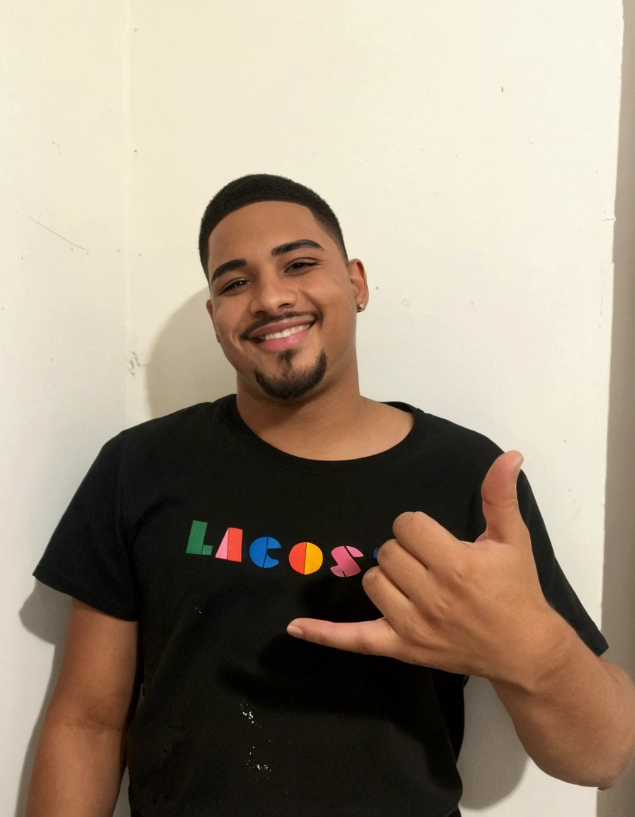 A boy with a beautiful smile, expensive eyes, short hair with a goatee, age 23 years, straight eyebrows, is wearing a black shirt