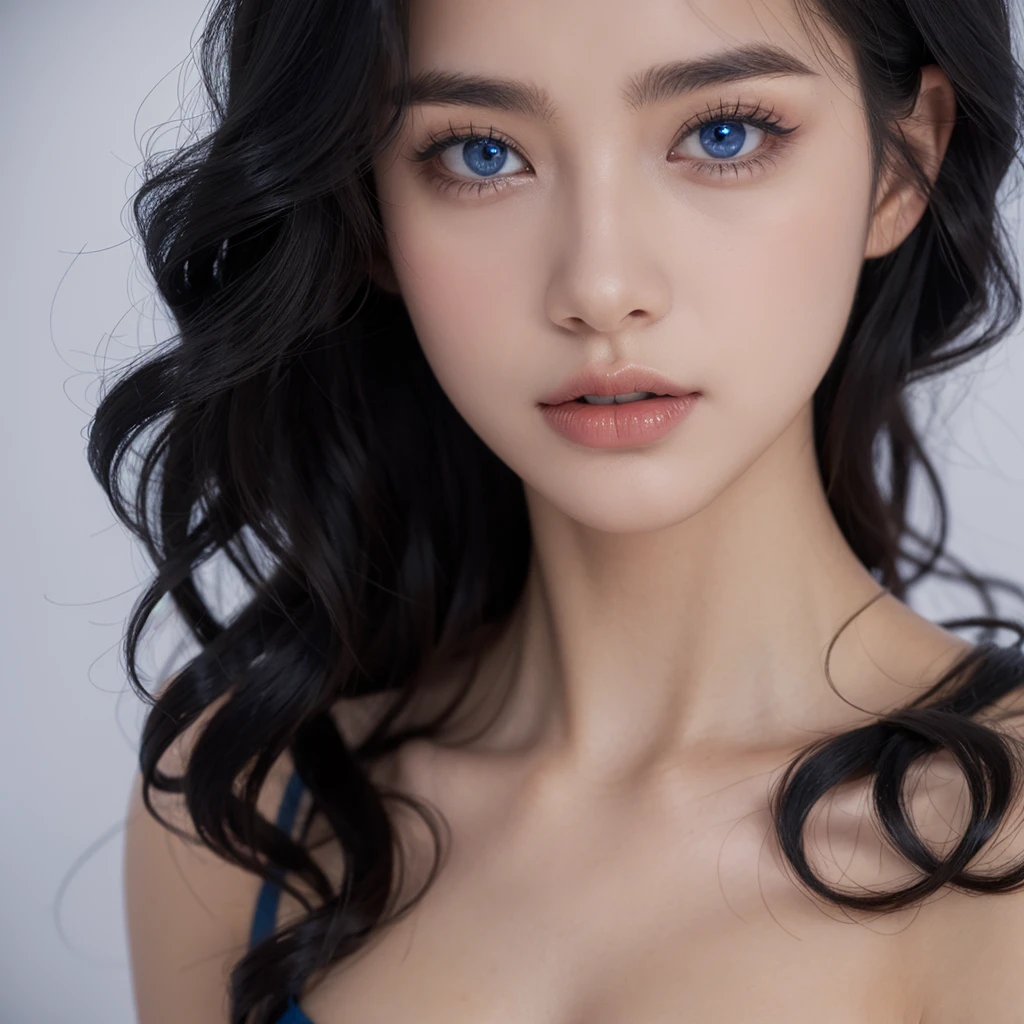 A woman with curly black hair, blue eyes