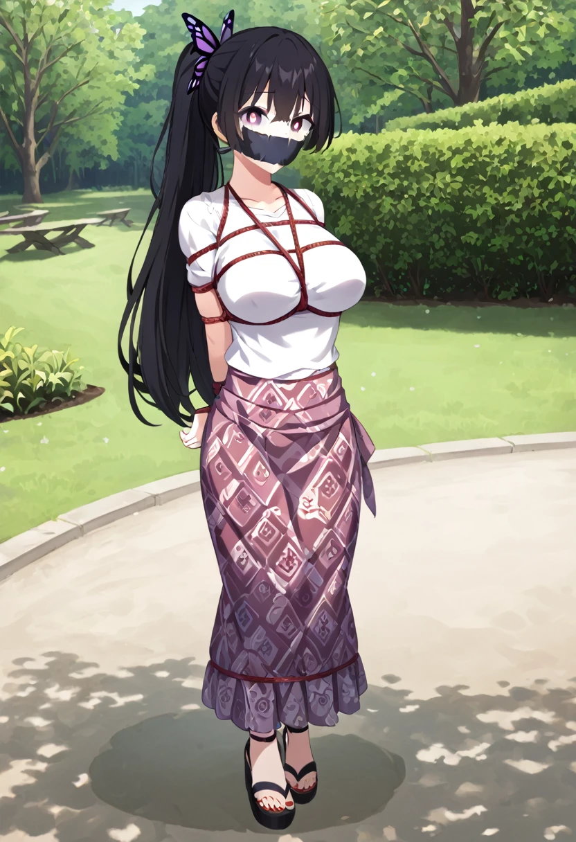 score_9, score_8_up, source_anime, 1girl, solo,The photo shows a young person standing outdoors, They are smiling and wearing a white t-shirt with a design featuring a rabbit and text, paired with a patterned purple sarong or long skirt and sandals. The background appears to be a garden or a green outdoor area..(bound wirsts), (arms behind back), (tapegag, tape gag), dramatic, (looking at viewer), (detailed pupils:1.3), ,red rope, thick rope,normal breast,full body ,long hair,black hair,ponytail hair, butterfly hair tie