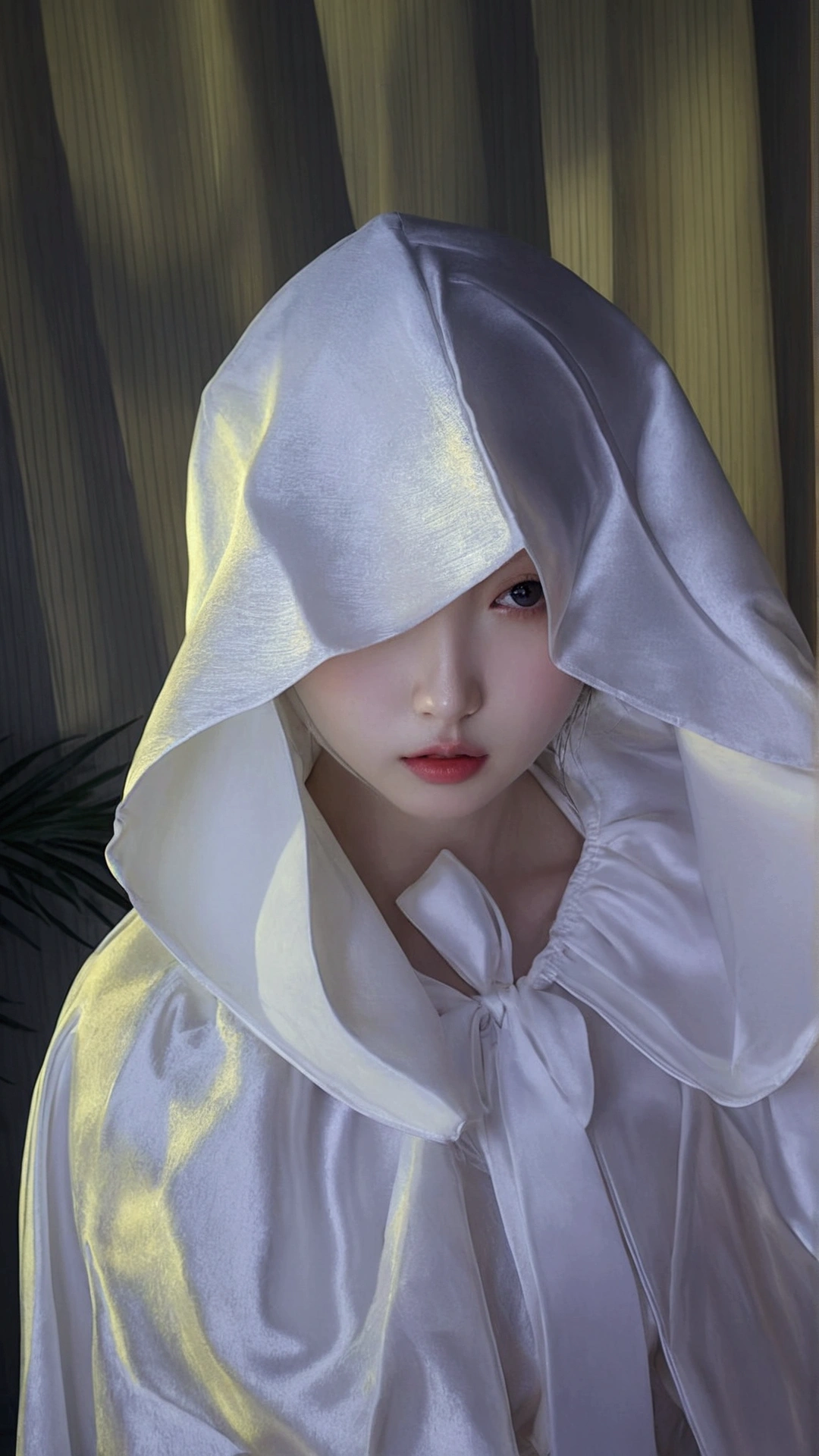 there is a woman in a white robe and a white hat, wearing white silk hood, pale snow white skin, pale young ghost girl, pale milky white porcelain skin, pale porcelain white skin, wearing white silk, glowing white face, wearing a luxurious silk cloak, porcelain white skin, pale white face, ulzzang, sakimichan frank franzzeta