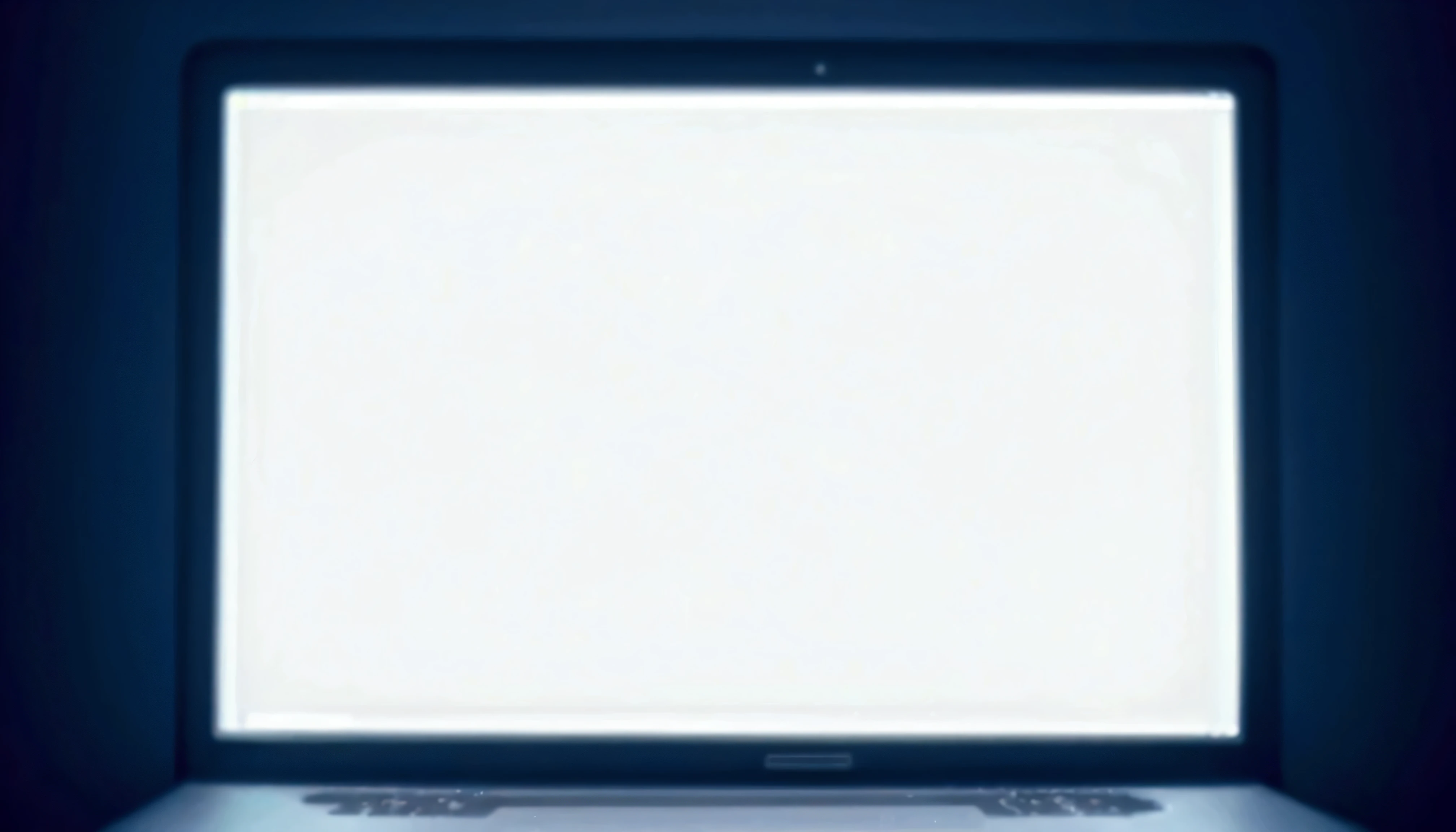 A laptop in a dark room
