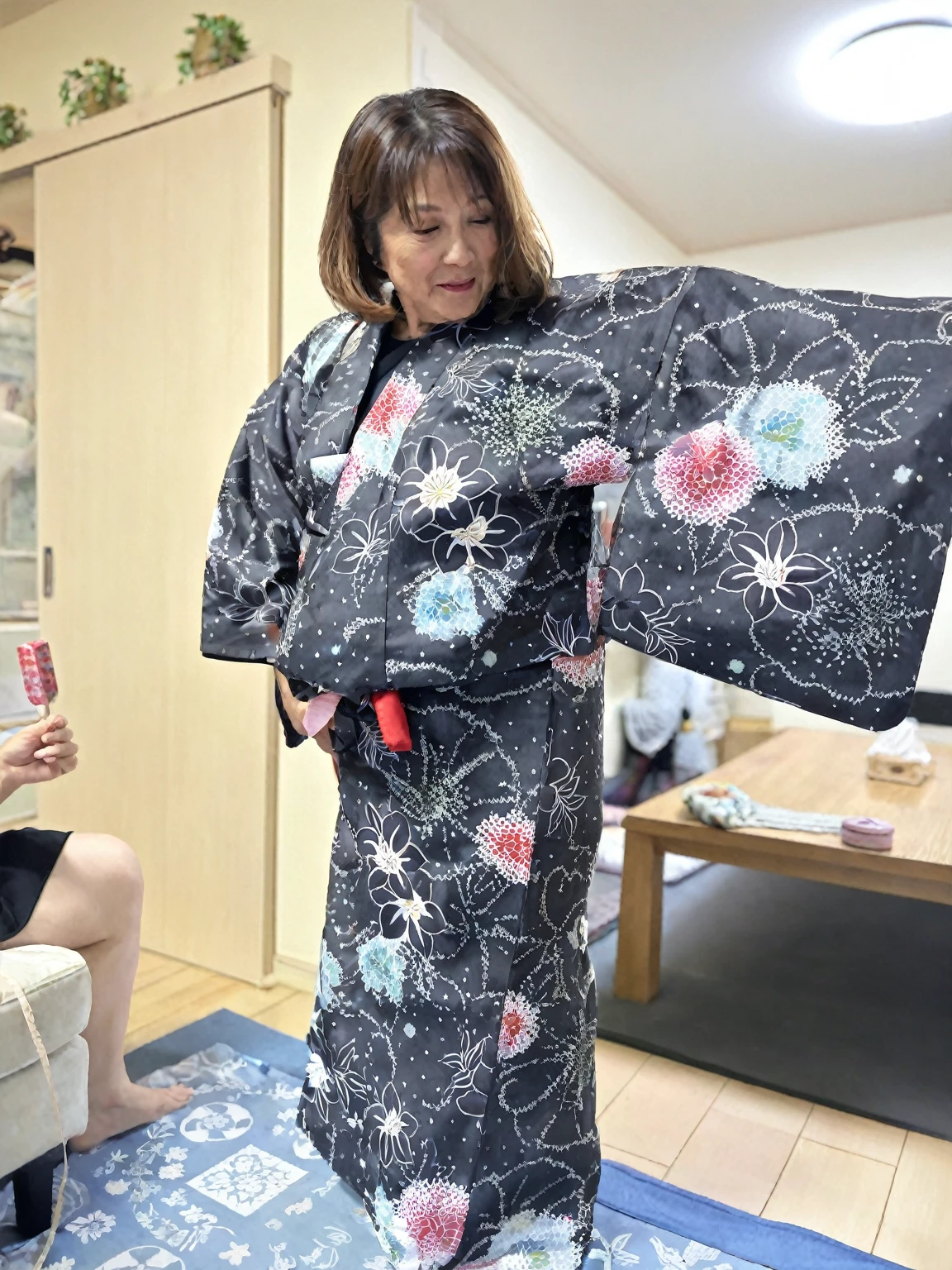 A woman in her 50s trying on a yukata