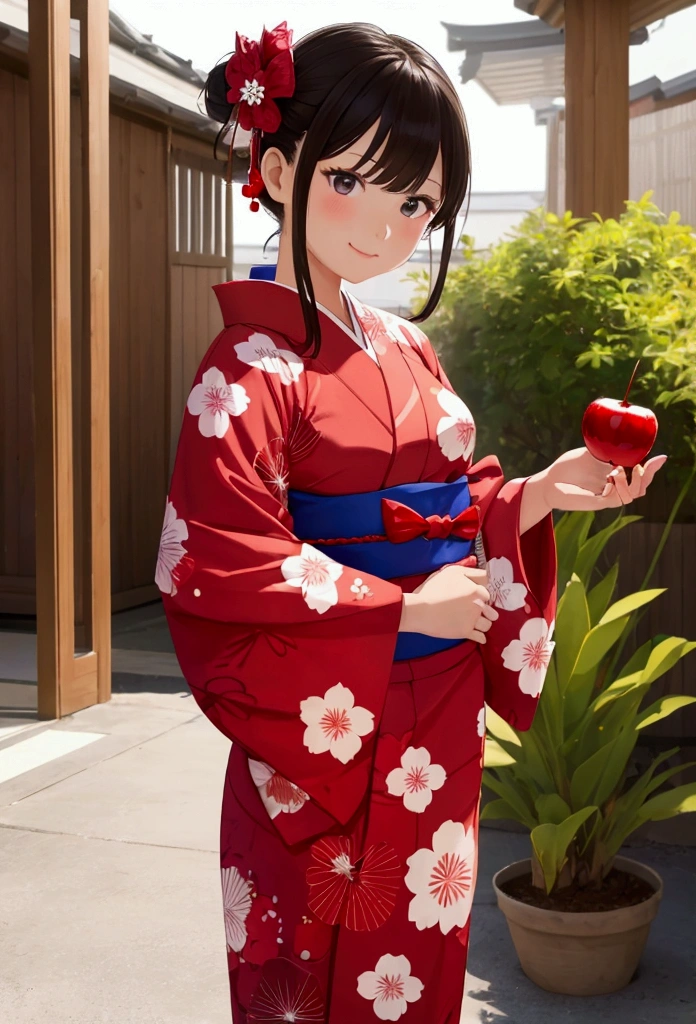 A girl wearing a yukata is holding a candy apple