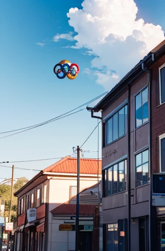 Olympic symbol floating in the sky,Country town