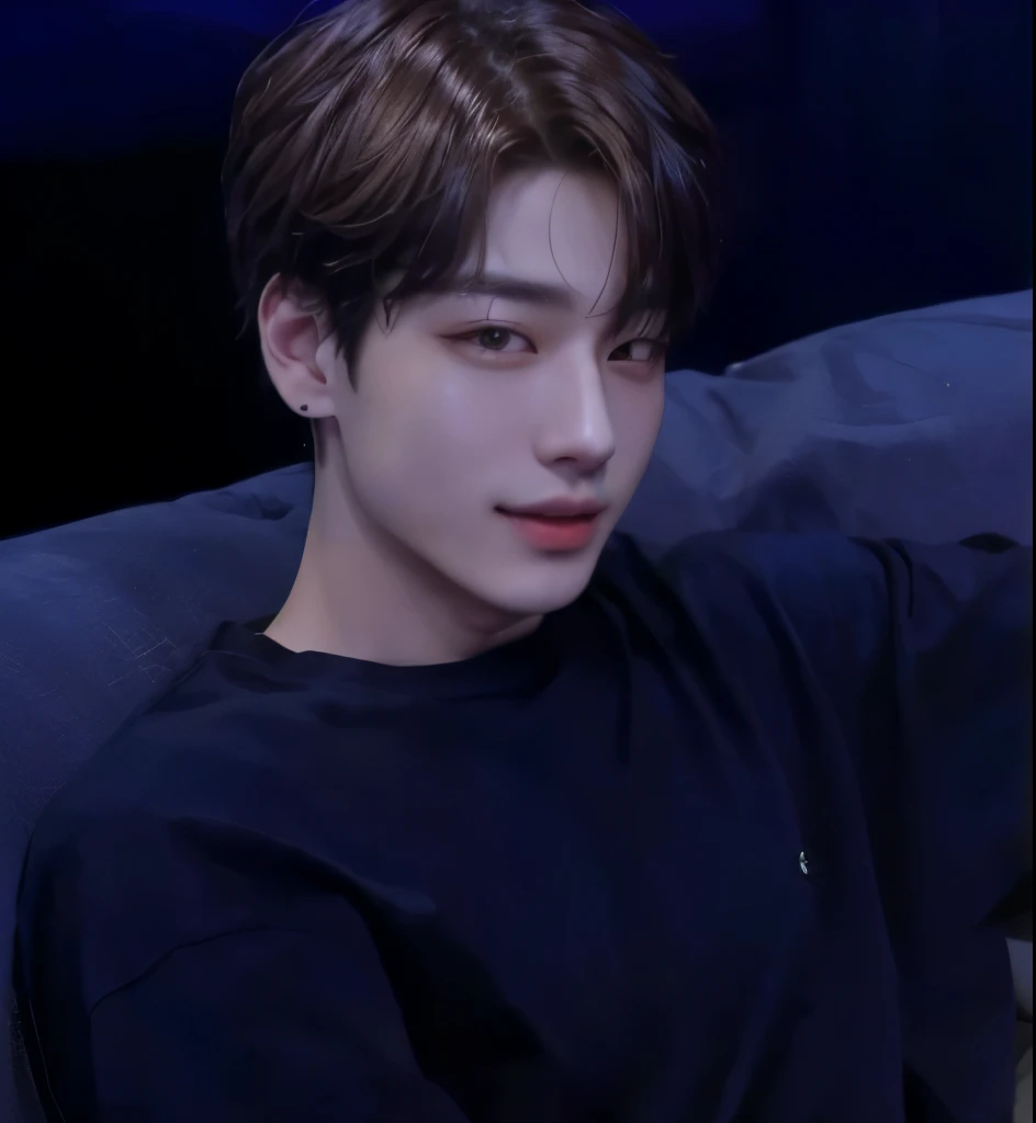 There's a man sitting on a couch, Jungkook, jeon jungkook , ironic smile, adorable and pale korean face, he is about 20 years old, he is about 20 years old