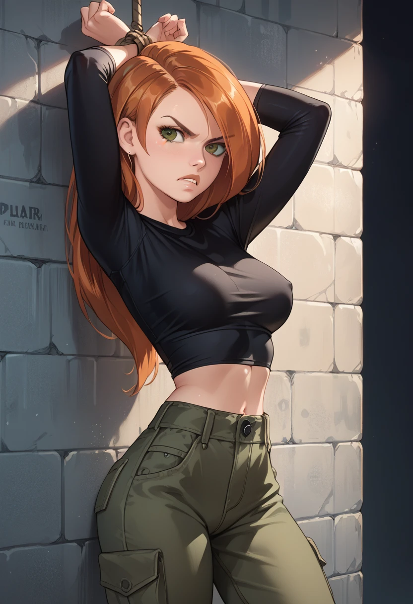 kim possible, detailed eyes, high detailing, narrow waist, 1girl, black tight shirt, long sleeves, cargo pants, angry look, on wall, hands bound,serious, bound arms, hands behind head, arms up, thigh, (bondage, rope bondage)