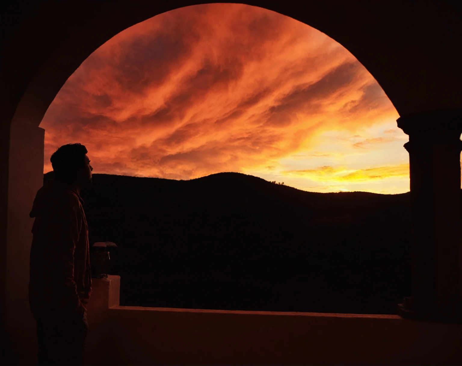 arafed view of a person standing in a doorway looking out at a sunset, looking out at a sunset, looking off into the sunset, the most beautiful sunset, spectacular sunset, silhouette over sunset, sunset in the background, during a sunset, with a sunset, sunset view, looking at sunset, watching the sunset, fire in the sky, orange and red sky