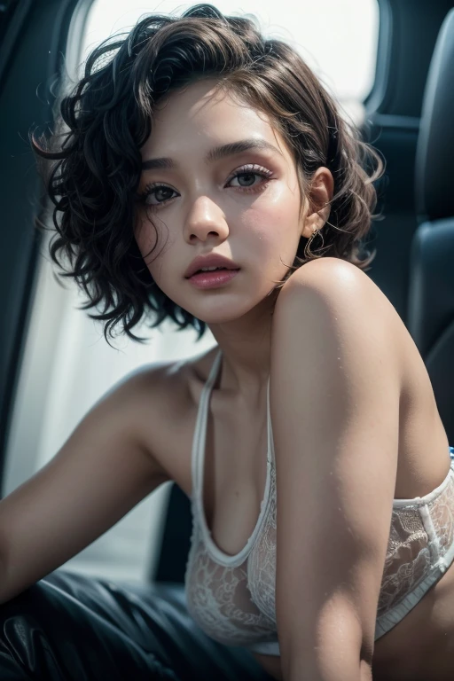 a young reggaeton singer with short curly hair