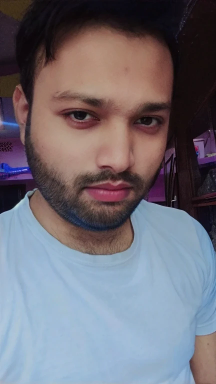A beautiful young bearded man with highly detailed skin.black hair.happy emotion