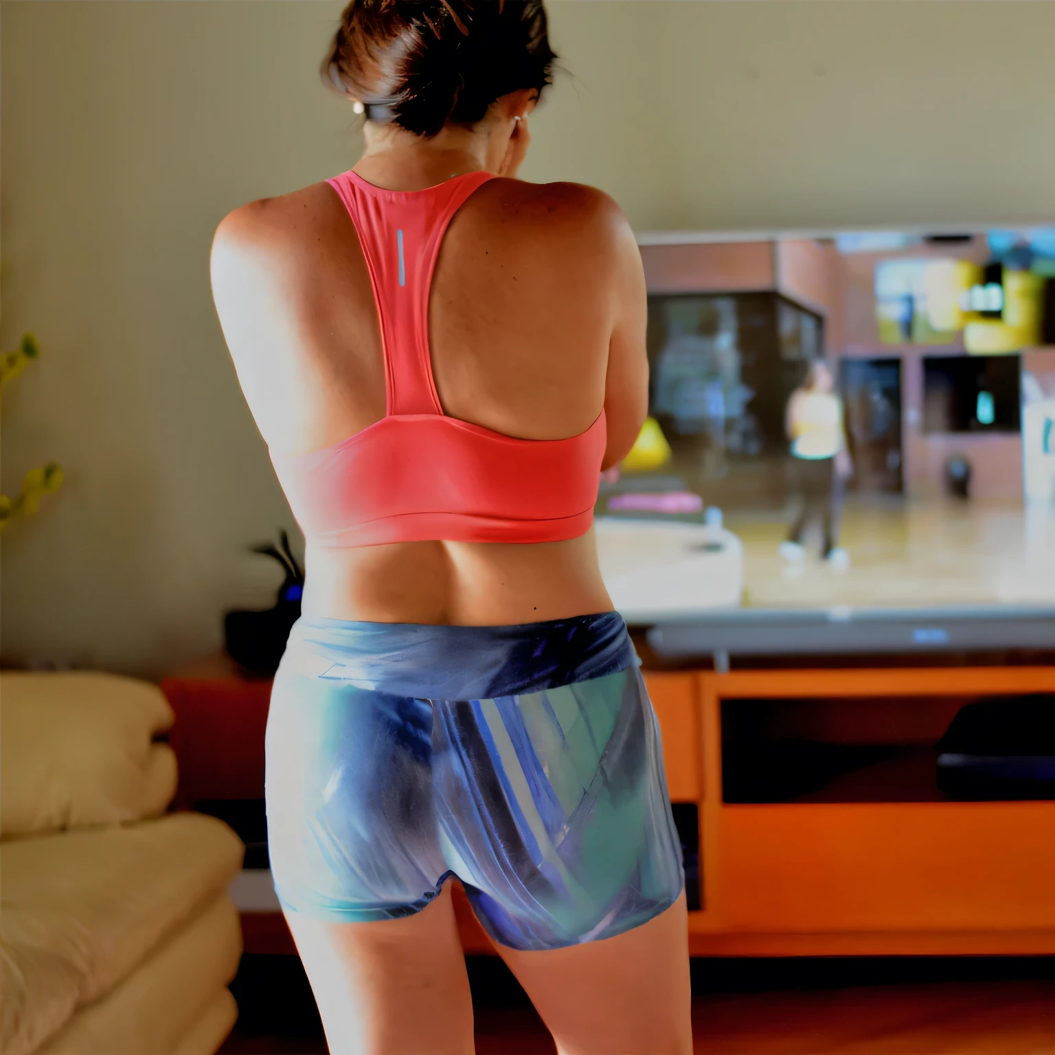 there is a woman in a pink top and blue shorts playing a video game, sport bra and shorts, back pose, toned derriere, back - shot, from the back, wearing fitness gear, back arched, rear-shot, shapely toned derriere, sport bra and dark blue shorts, back shot, from back, shot from the back