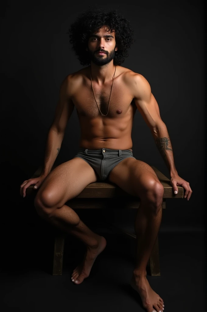 photograph of a beautiful man with curly black hair and a beard, he is naked, he is sitting in a chair, leaning over a bench, professional photography, sensual gay shoot, photography with studio lighting in a dark environment, high resolution