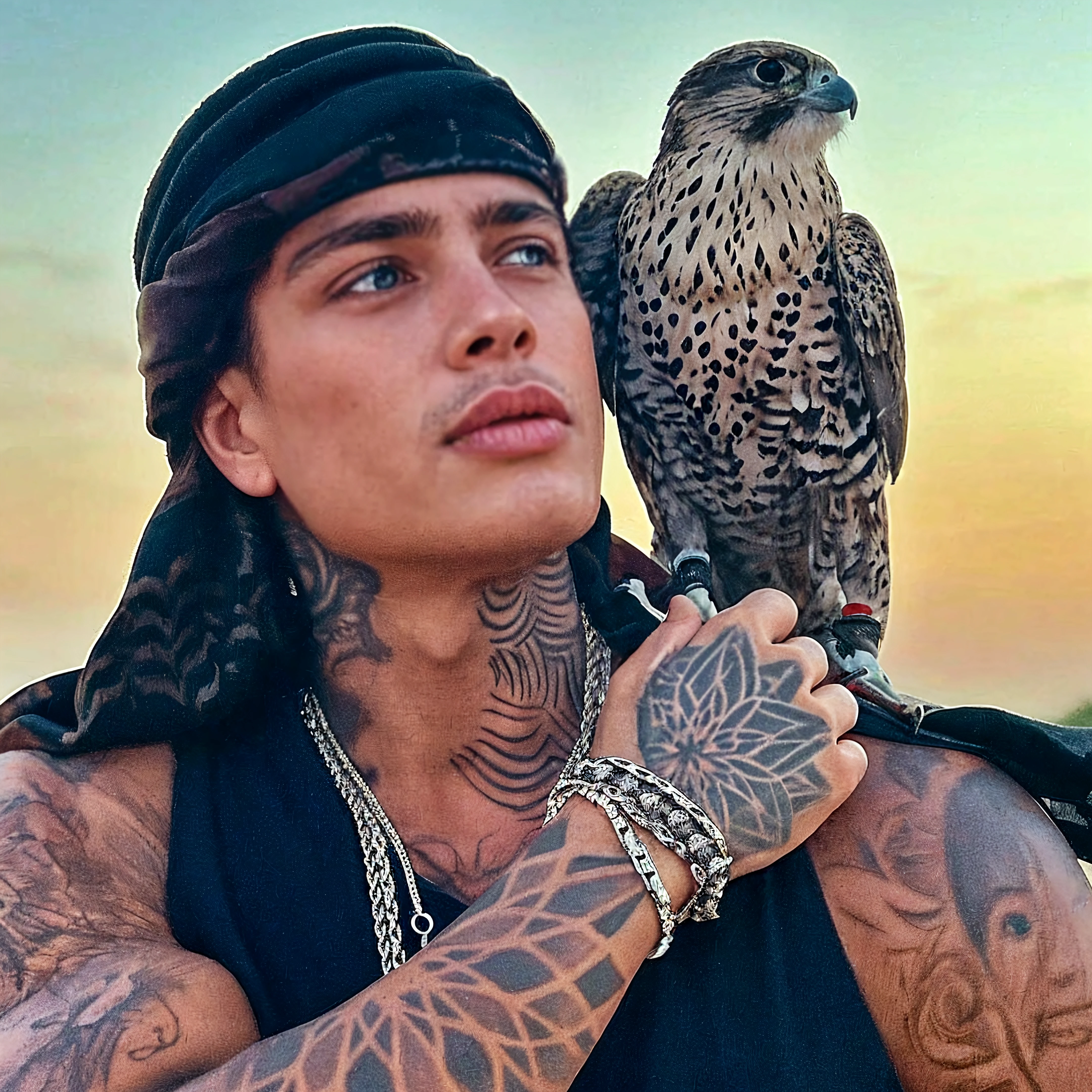 A handsome beautiful slim shirtless white skin man in the desert with a falcon