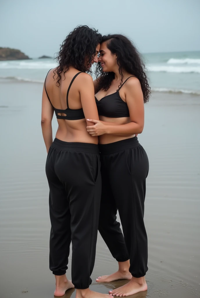 black hair, black sweatpants, White skinned, Braless, Barefoot woman cuddling with her friends on the beach