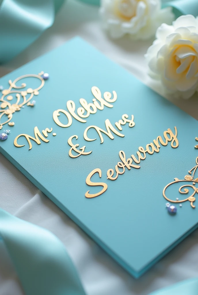 A sky blue and gold Wedding card for Mr Olebile & Mrs Seokwang no photos