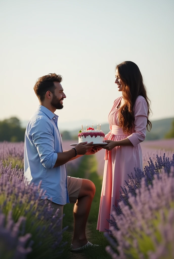 A man facing his left is the husband kneeling to give a birthday cake to his wife facing her right amidst a field of lavender.