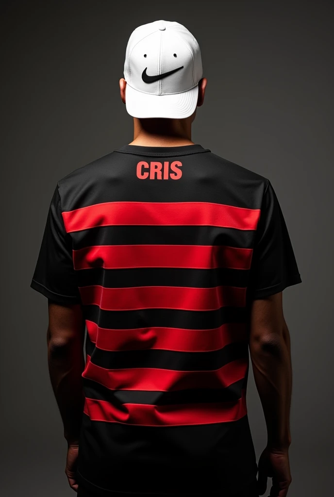 A photo of a man turned around with his back to the shirt wearing a black shirt with thick red stripes like the others filling the entire shirt horizontally with the name Cris highlighted on the top of the shirt and a white Nike cap turned backwards with the symbol highlighted.