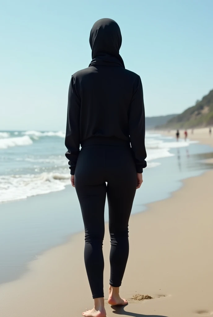 with black headscarf, barefoot, Woman in black tracksuit undresses completely on the beach