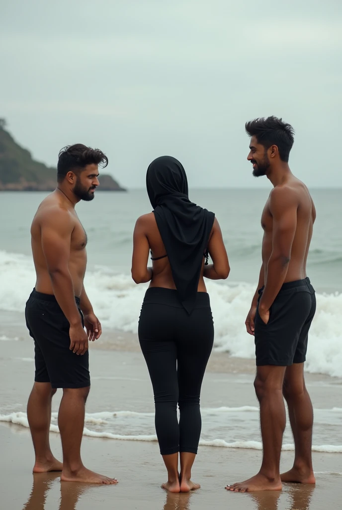 barefoot, with black headscarf,black pants, braless woman chatting with male friends on the beach