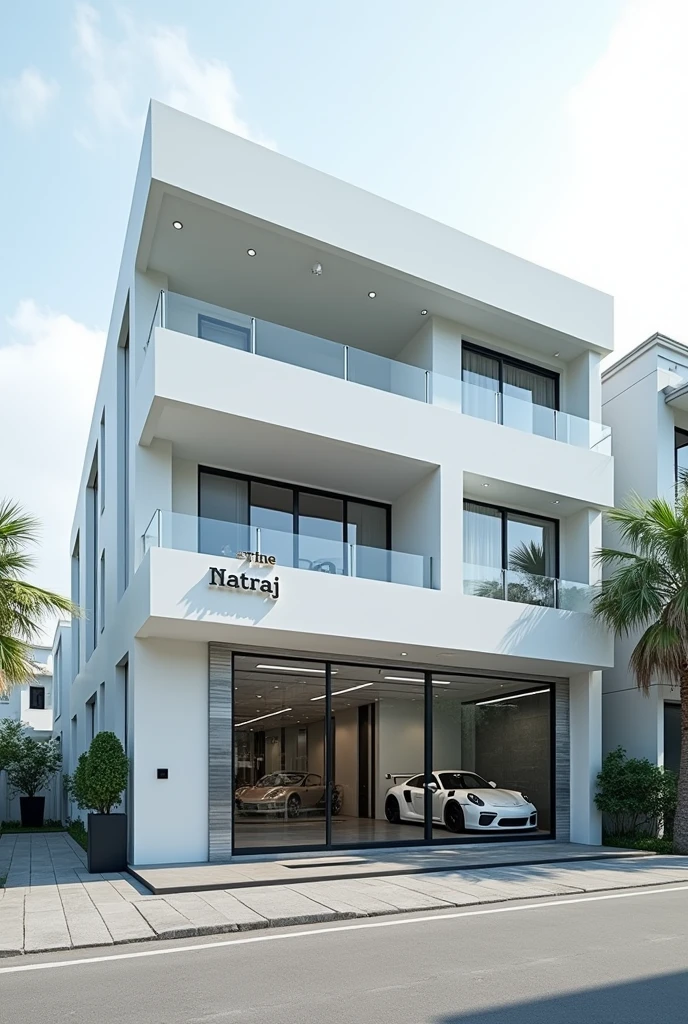 “A three-story car modification shop named 'The Natraj,' with a fully white building and a very beautiful aesthetic elevation. There are no glass windows at the front. At the bottom, there is a black border with a transparent square door. On the right side, there is a large transparent glass section displaying a sports car inside, and large modification flags are placed on the side."