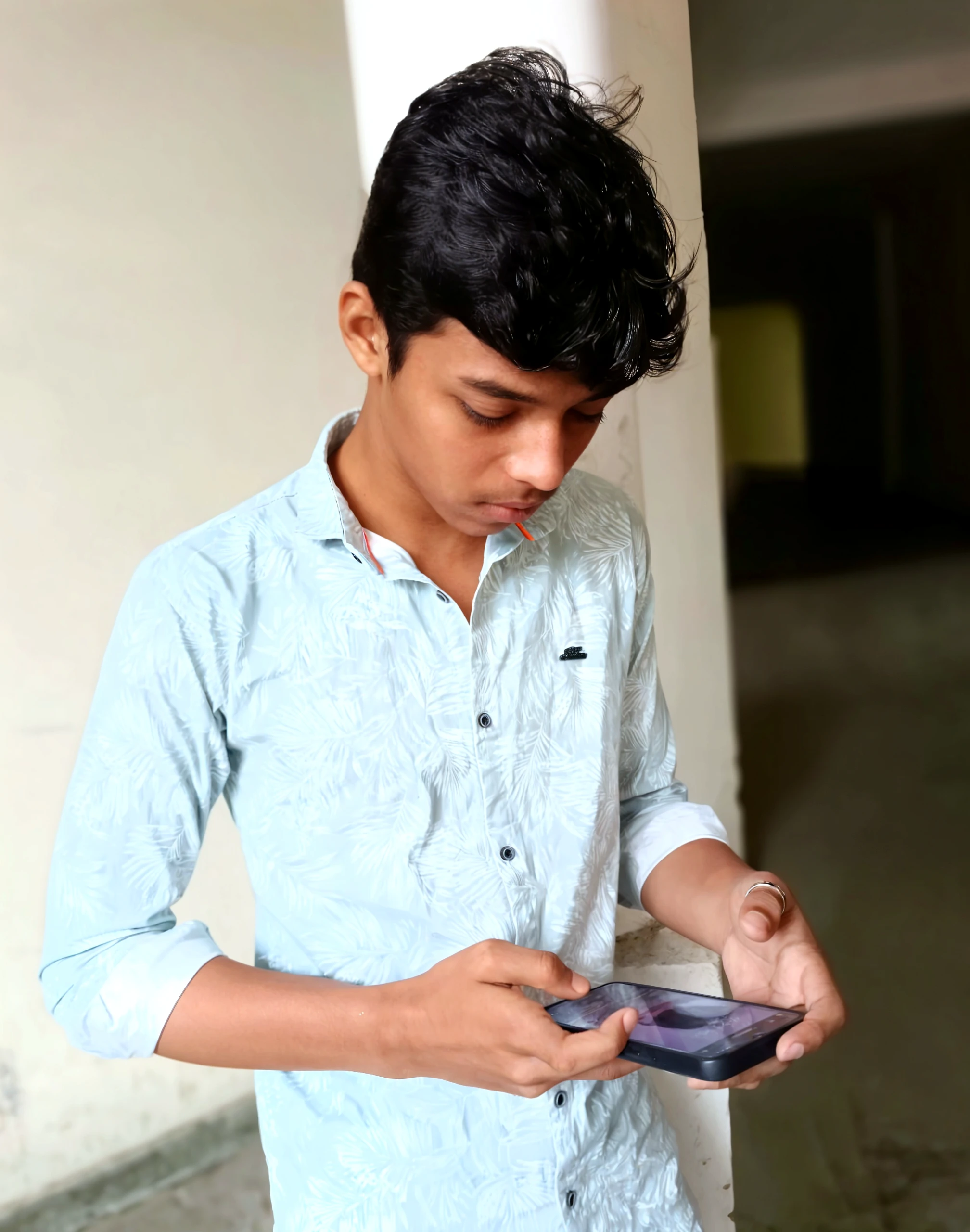 A boy with short hair sitting in a shop with white t-shirt and black pant with skinny body watching his watch with realistic face