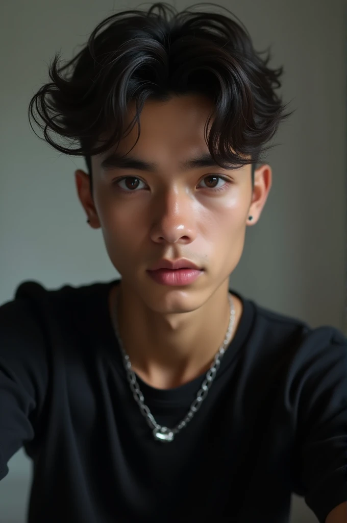 handsome  boy wearing black shirt and necklace taking a selfie 