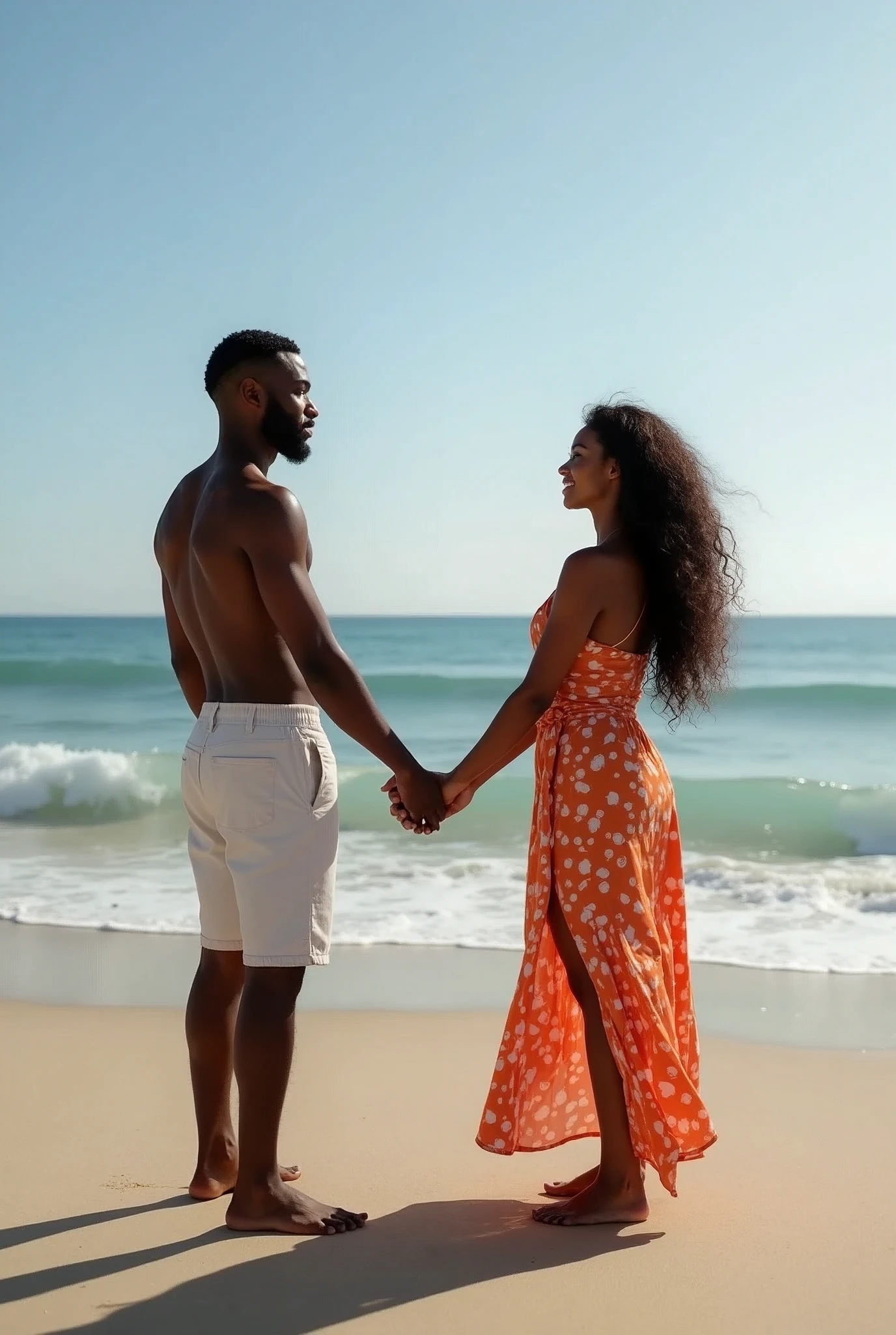 an african male artist with her girlfriend holding hands at the beach