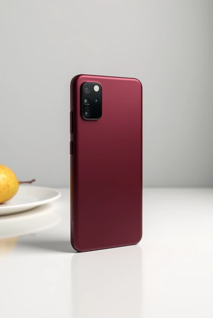 A wine-colored cellphone with a vertical camera that is identical to the previous one and is standing upright in a vertical position. It is resting on a white table, with no pears around.