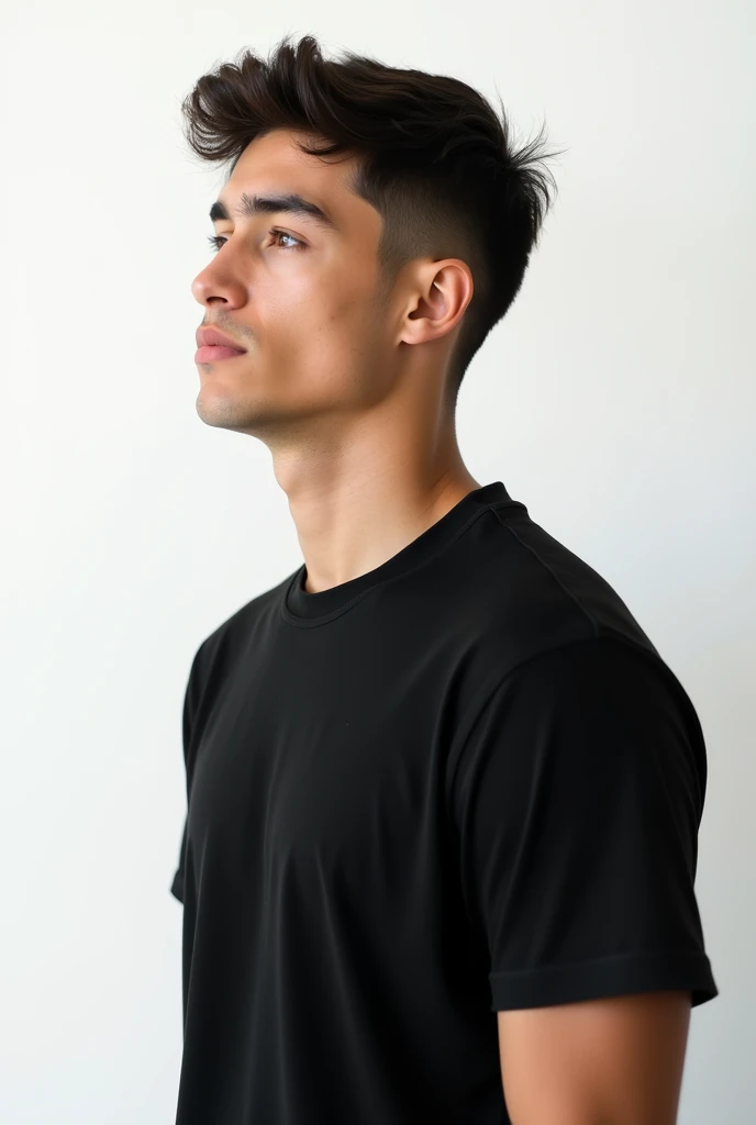 Young man wearing plain black unisex t-shirt, on a white background 