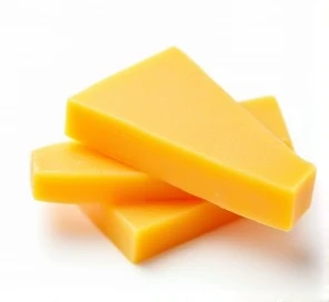 slices of cheddar cheese on a white background