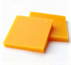 thin and square slices of Frimesa brand cheddar cheese with a white background