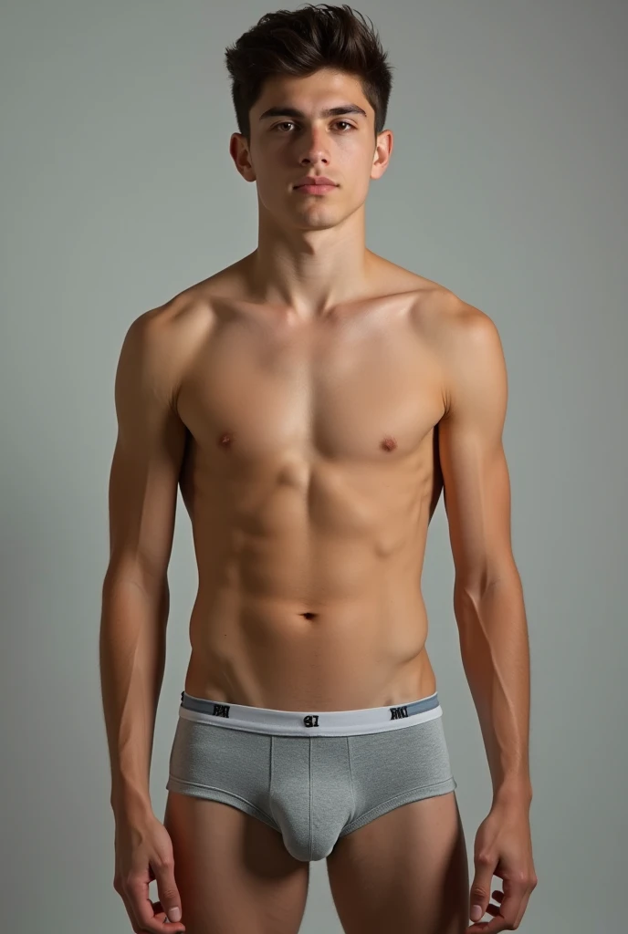 Photo of a young 20 year old boy in short and very tight briefs showing a realistic package