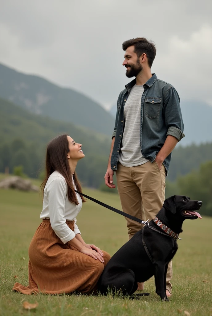 A man casually dressed standing with her wife wearing a long skirt kneeling on his left and a black dog on a leash on his right side
