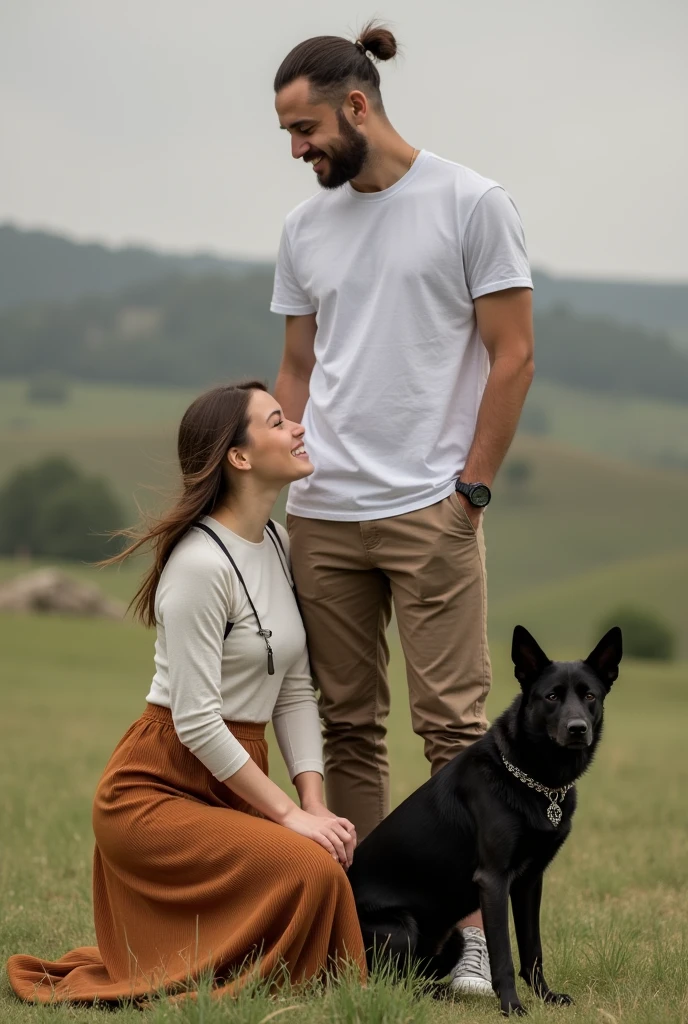 A man casually dressed standing with his wife kneeling on his left wearing a long skirt with an adoring face and a black dog on his right side