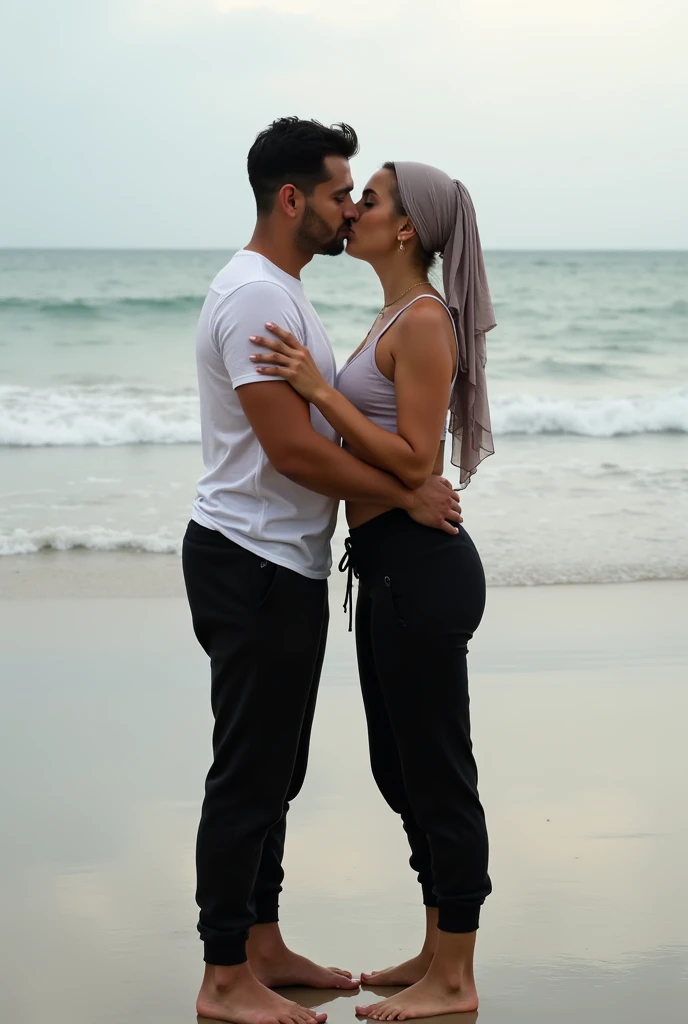 Black headscarf on the beach, white long sleeve t shirt, baggy black sweatpants, barefoot, Sexy skinny woman. Man kneeling in front of woman, Woman touching the front of man's sweatpants with her foot.