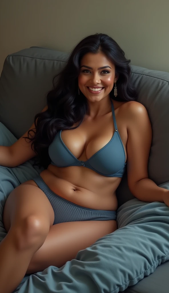 A beautiful gorgeous plump Indian 45-year-old woman wearing a thin blue bra panty, long hair, huge breasts, hot body curves, smiley face, white skin, laying on sofa with 21 years old handsome man