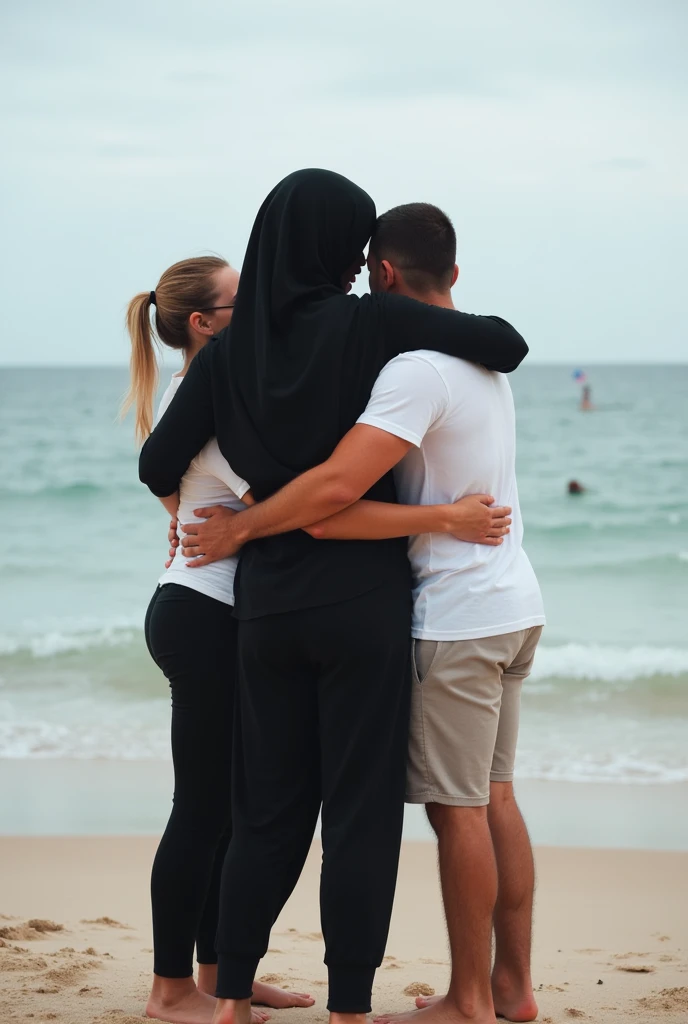 with black headscarf, barefoot, 2 women in black sweatpants,   Two men in white t-shirts hugging each other on the beach