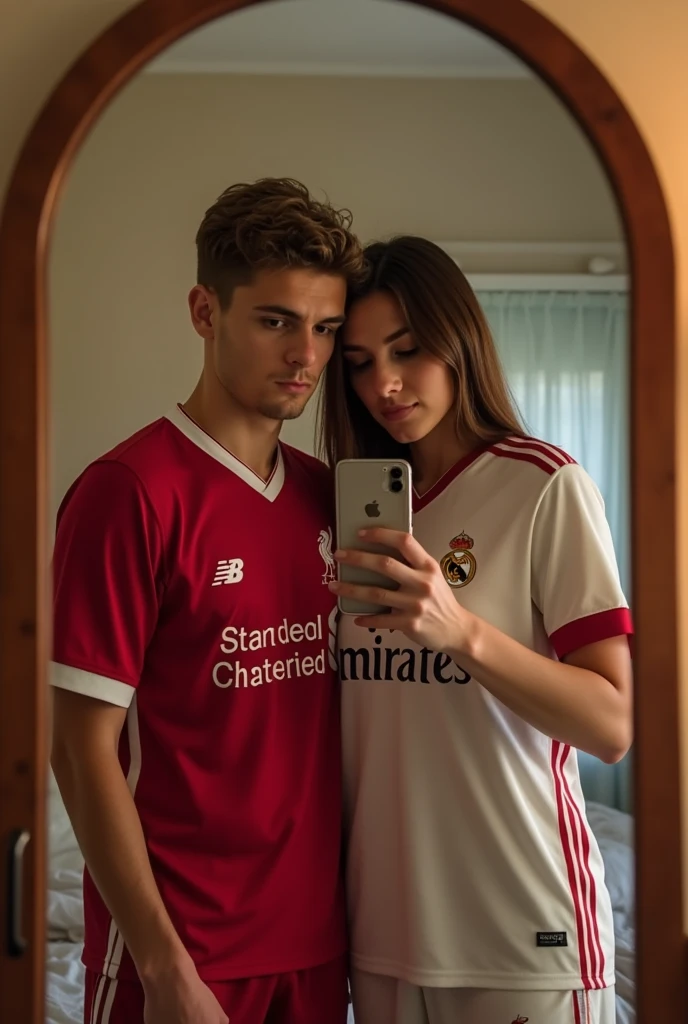 A 22 years old boy, who wear a Liverpool Jersey.. And and a 20 years girl who wear a real madrid Jersey.. They are couple and they click a mirror selfie