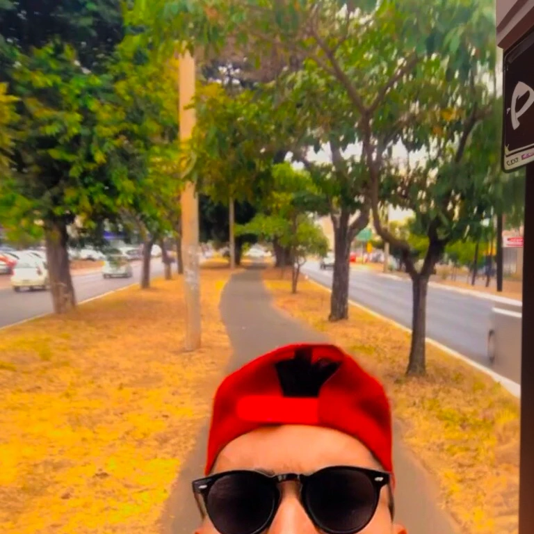 there is a man taking a selfie on a street, aboriginal australian hipster, profile image, wearing a red rear-facing cap, profile pic, profile image, inspired by Antônio Parreiras, wearing sunglasses and cap, Matthew 9 5, 23 year old, inspired by Nathan Oliveira, youtuber, avatar image, Lucas Graziano, André Rios