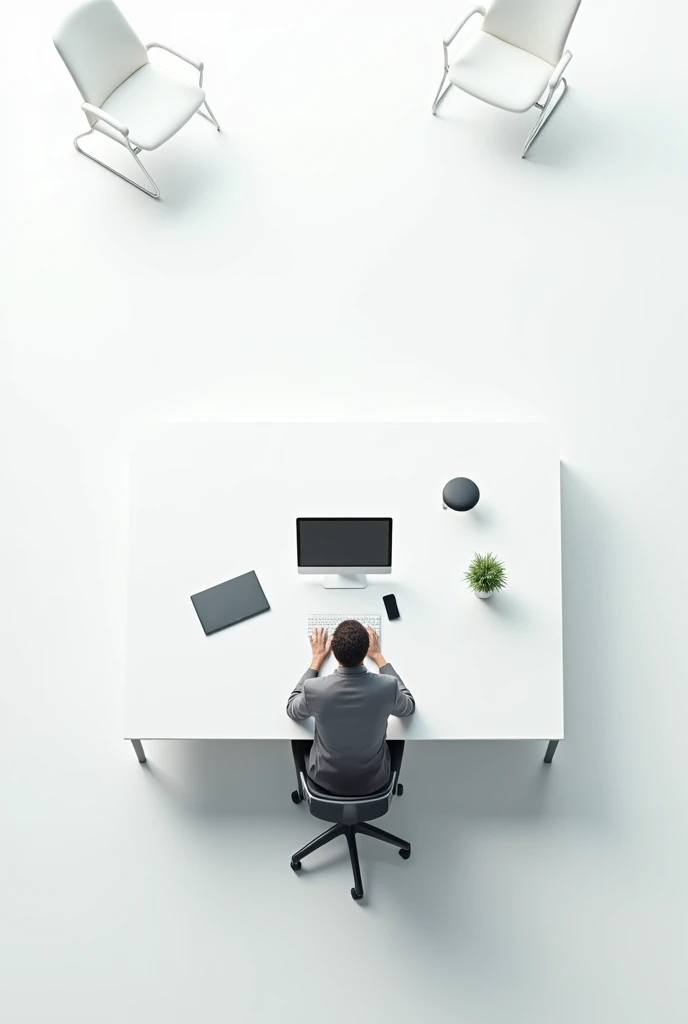 White office table with man sitting on a chair viewed from above