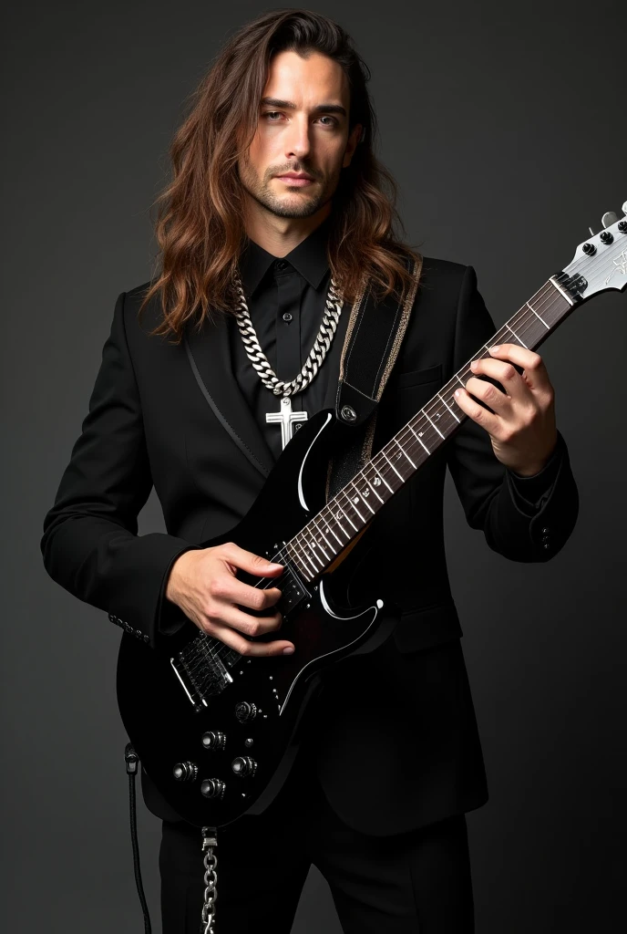 Handsome guy with long hair dressed in black suit with a black guitar and chains