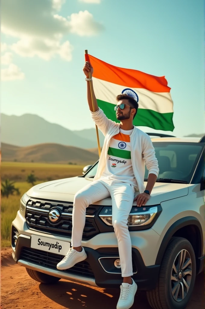 Create an Real image featuring a young man sitting on the hood of scorpio car, with Indian's scenic background. He's holding a flag celebrating Indian 15th August. The boy wears a soumyadip T-shirt with ' soumyadip ' printed on it, white jacket, white pants, white shoes ."
