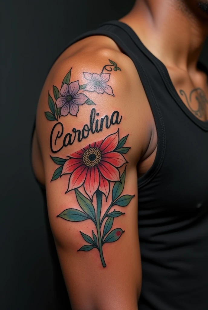 Floral tattoo with the name Carolina on flowers for a black-skinned man on his arm.