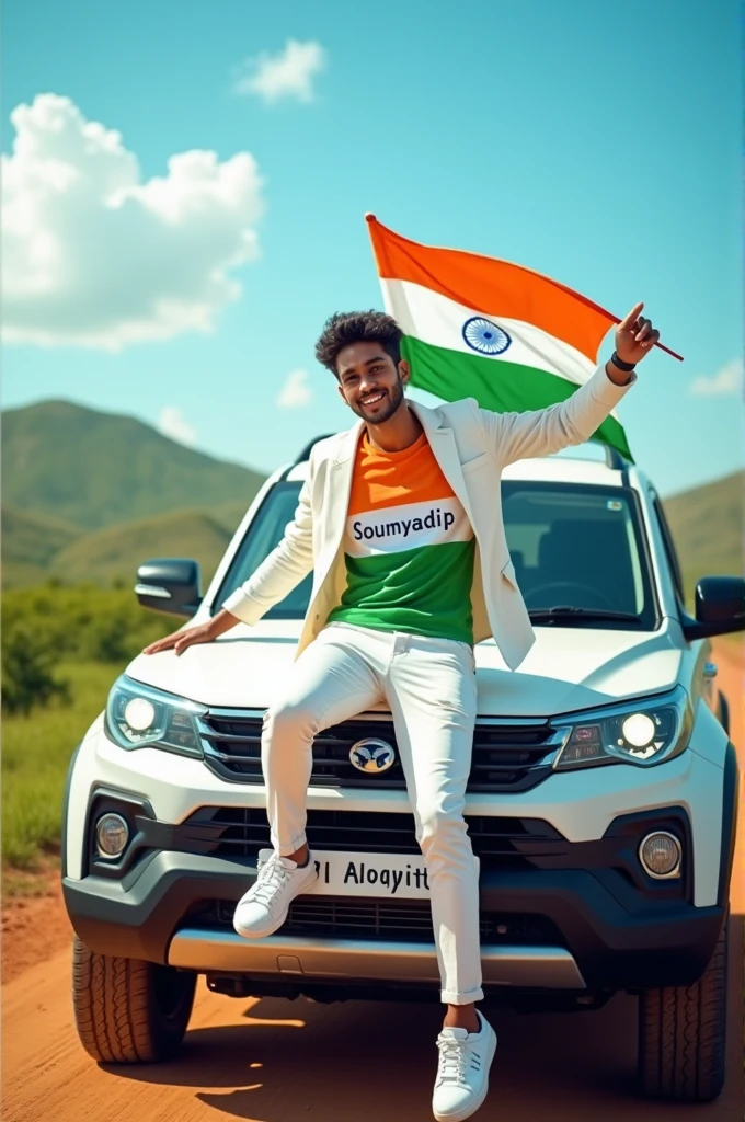 Create an Real image featuring a young man sitting on the hood of scorpio car, with Indian's scenic background. He's holding a flag celebrating Indian 15th August. The boy wears a tirnga T-shirt with 'soumyadip' printed on it, white jacket, white pants, white shoes